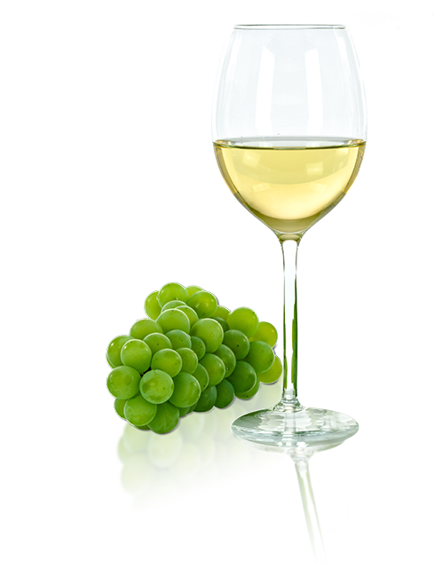 Glass of wine next to green grapes